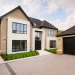 House with anthracite grey sheerline prestige windows - Castle Windows