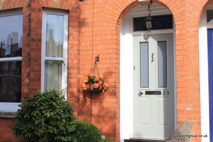 Orange brick house with an agate grey composite door, Maidenhead - Castle Windows